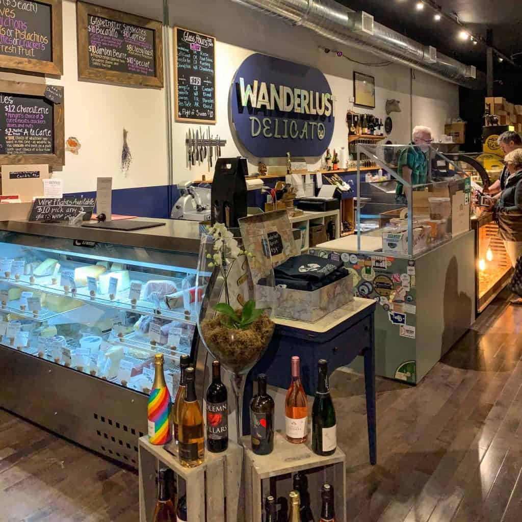 Photo of the inside of Wanderlust Delicato, a Spokane shop specializing in wine and cheese from around Washington state and beyond