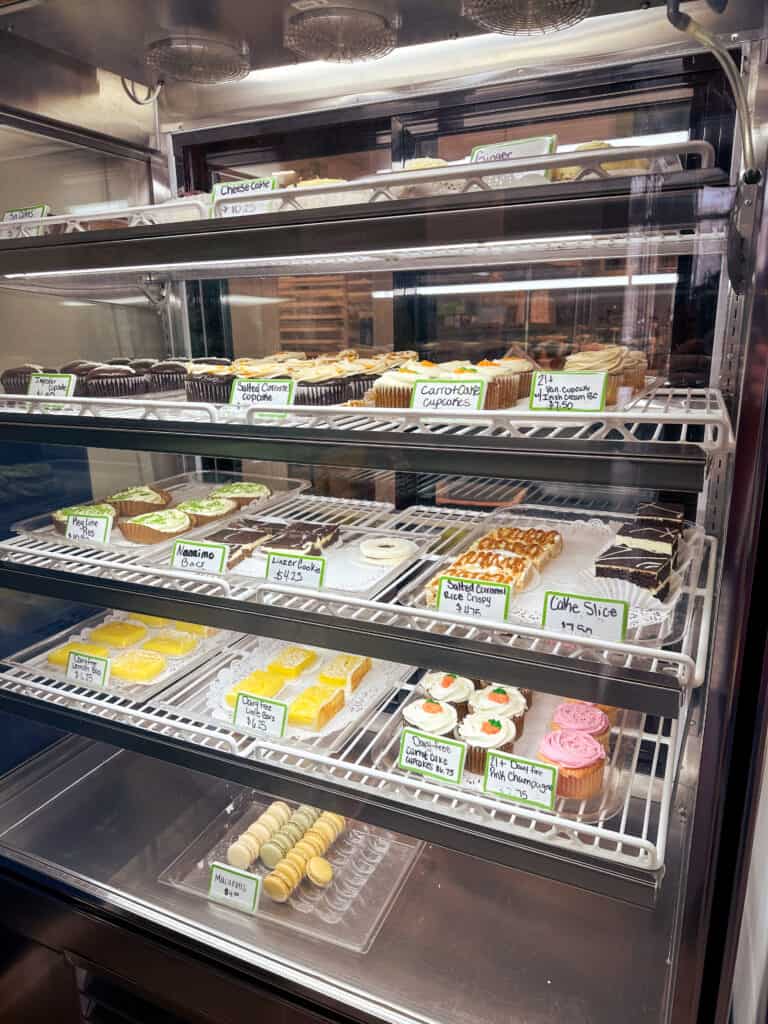 A photo of the baked goods case at Cole's Bakery, a gluten-free restaurant in Spokane. Pictured are brownies, cookies, cupcakes and macarons. 